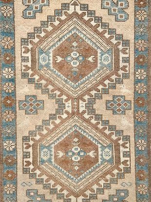 A close up of a rug with a geometric pattern on it.