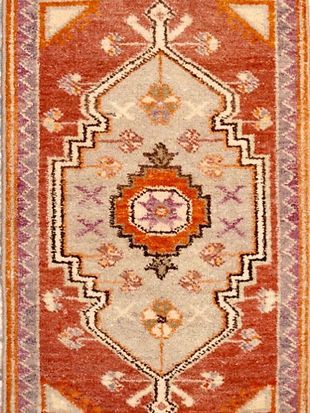 A close up of a rug with a pattern on it