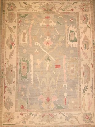 A rug with a floral pattern on it is sitting on a table.