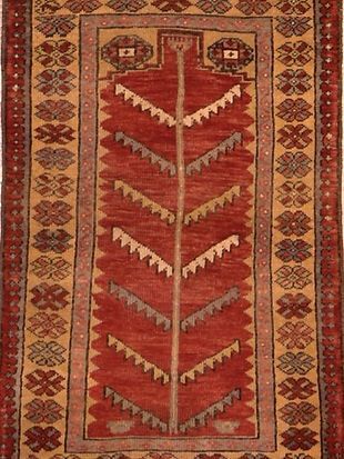 A rug with a tree design on it