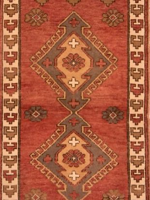 A close up of a rug with a geometric pattern on it