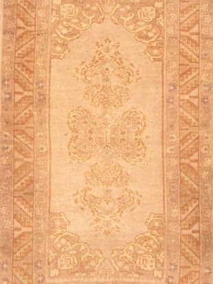 A close up of a rug with a floral pattern on it.