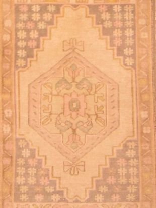 A close up of a rug with a geometric pattern