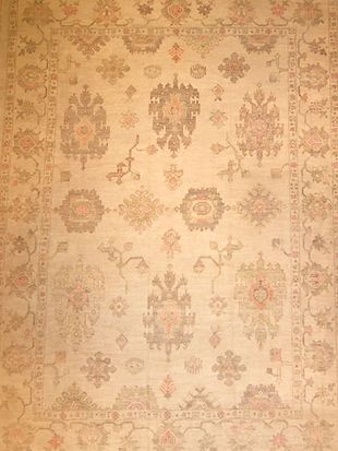 A close up of a rug with a floral pattern on it.
