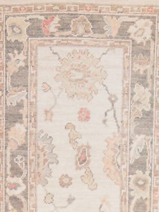 A close up of a rug with a floral pattern on it.