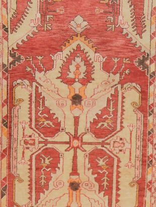 A close up of a rug with a floral pattern on it