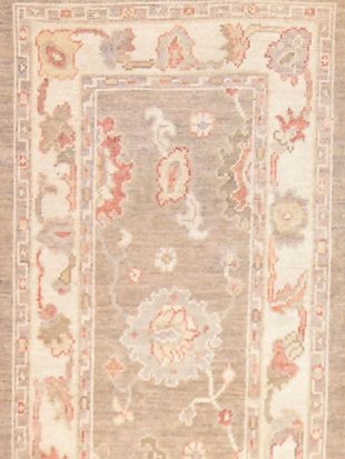 A rug with a floral pattern on it is sitting on a table.