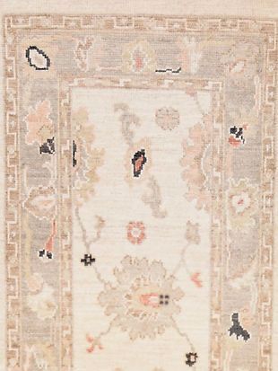 A close up of a rug with a floral pattern on it.