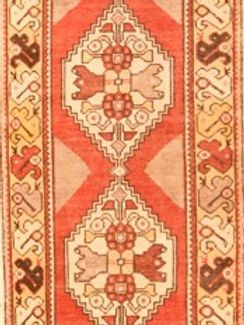 A close up of a rug with a floral pattern