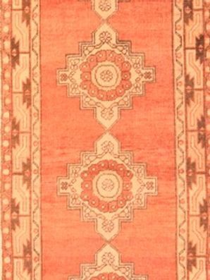 A close up of a rug with a pattern on it