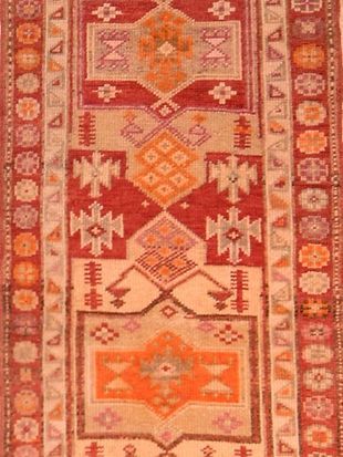 A close up of a rug with a geometric pattern on it