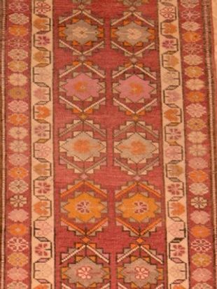 A close up of a rug with a geometric pattern