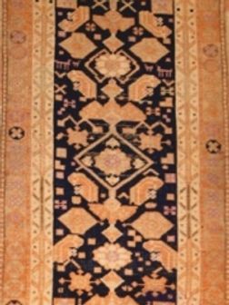 A close up of a rug with a geometric pattern