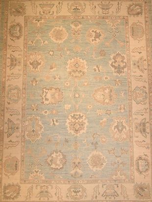 A close up of a rug with a floral pattern on it.