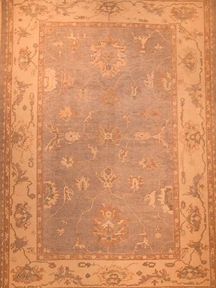 A close up of a rug with a floral pattern on it.