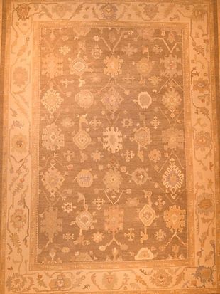 A rug with a pattern on it is sitting on a table.