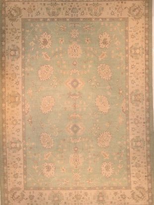 A rug with a floral pattern on it is sitting on a table.