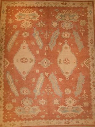 A rug with a floral pattern on it is sitting on a table.
