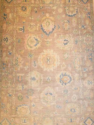 A close up of a rug with a floral pattern on it.