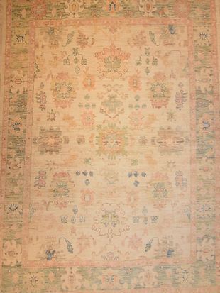 A close up of a rug with a floral pattern on it.