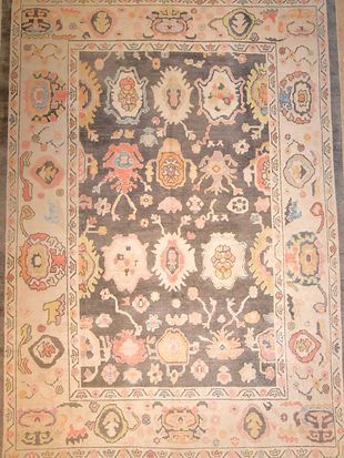A rug with a floral pattern on it is sitting on a table.