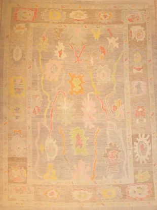 A rug with a floral pattern on it is sitting on a table.
