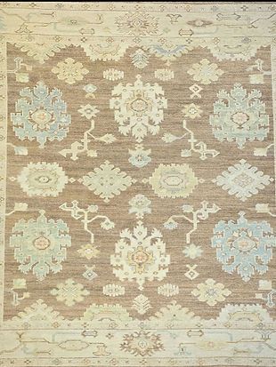 A rug with a floral pattern on it is sitting on a table.