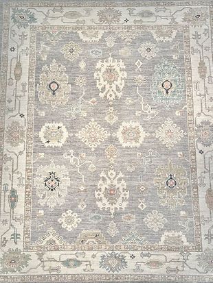 A close up of a rug with a floral pattern on it.