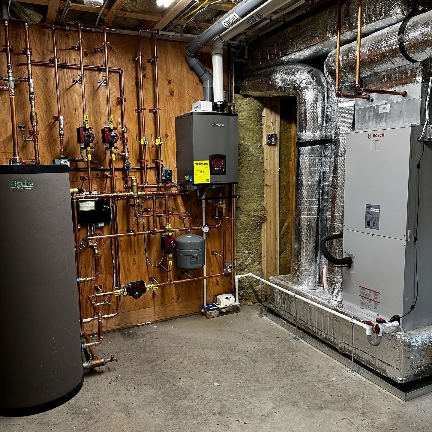 a room with a heater and a tank that says