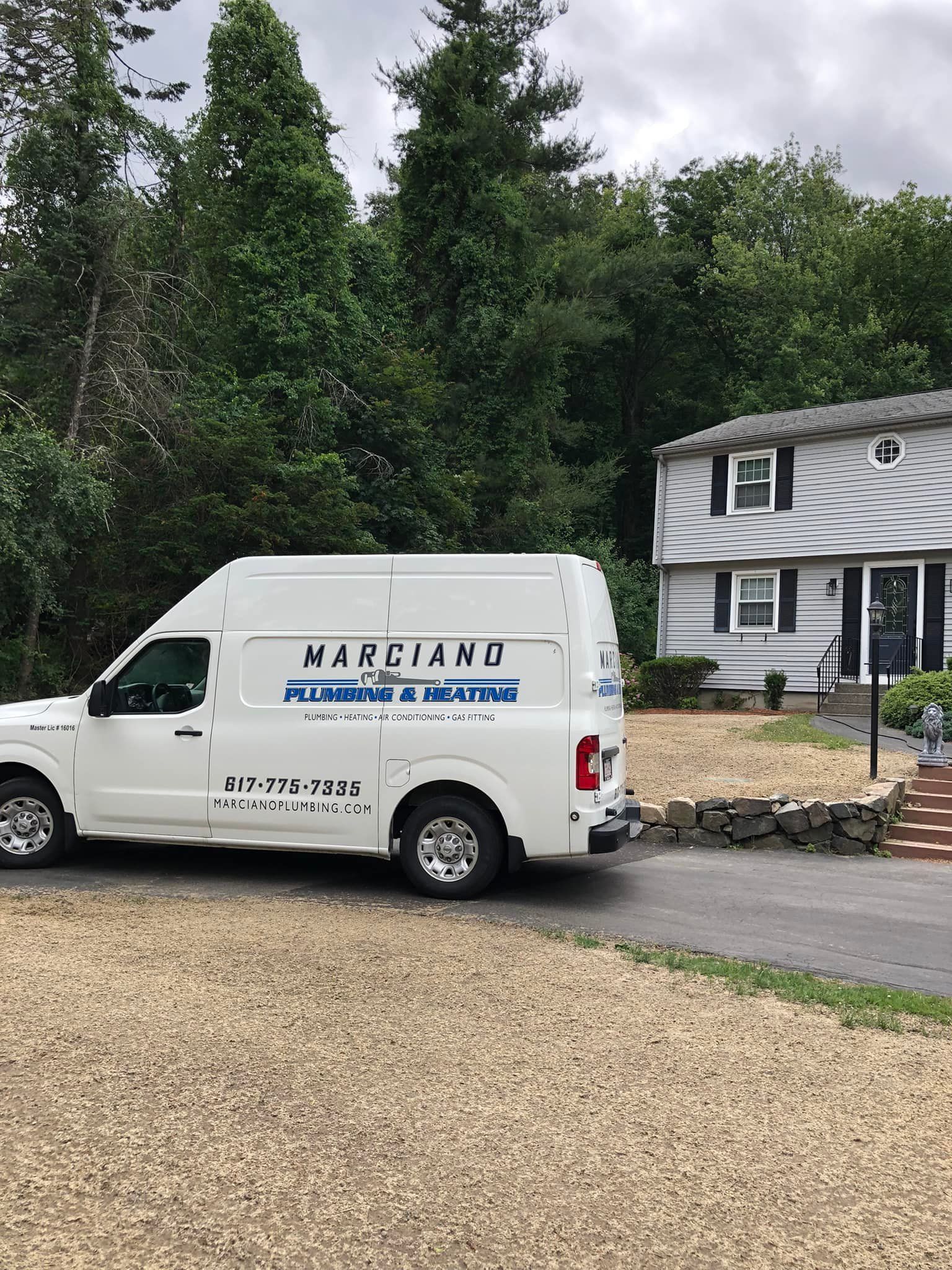 a white van is parked in front of a house