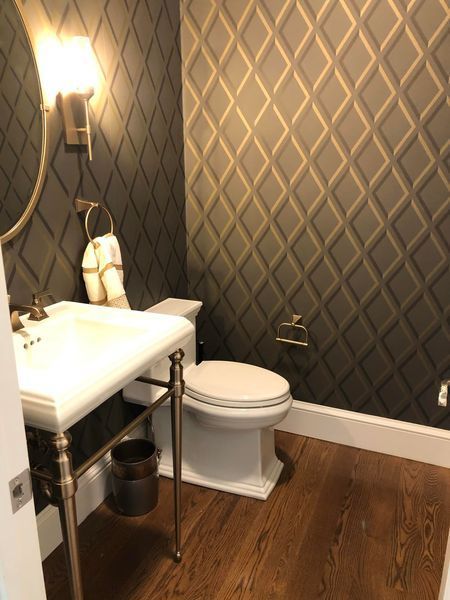 a bathroom with a toilet a sink and a mirror