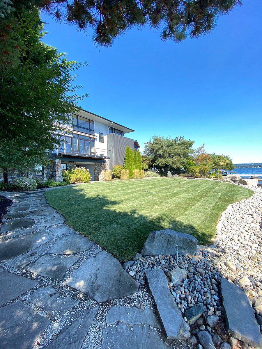 A large house with a large lawn in front of it.
