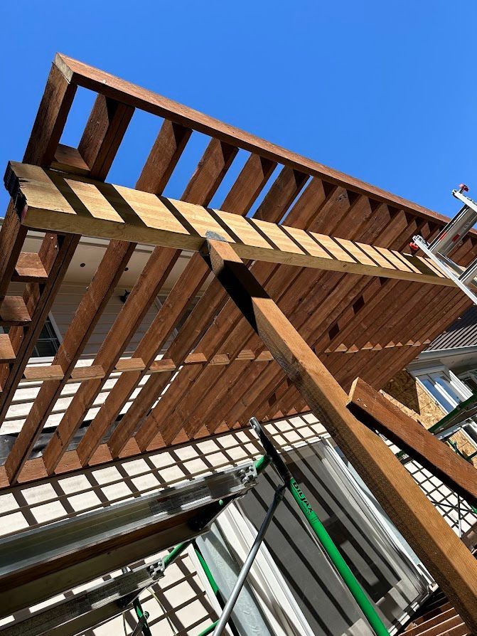 A wooden structure is being built on top of a building.