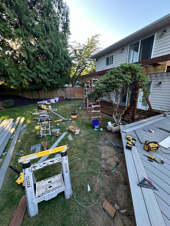 A deck is being built in the backyard of a house.