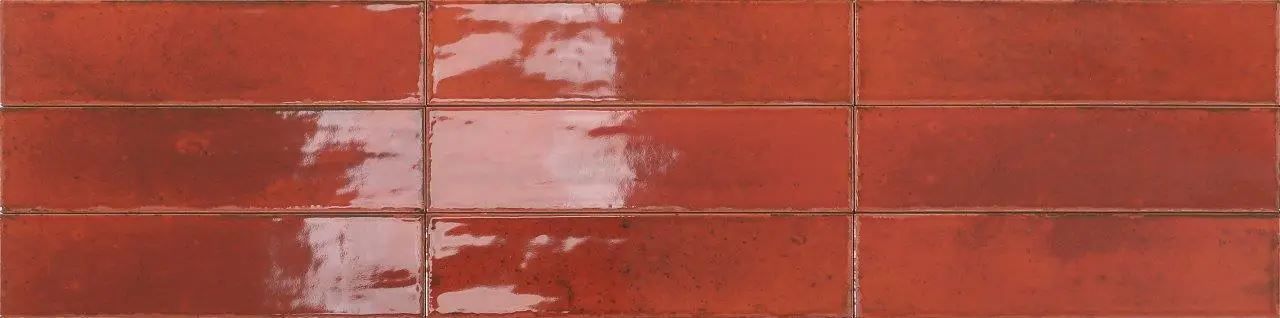 Red brick wall with horizontal mortar lines and weathered white streaks