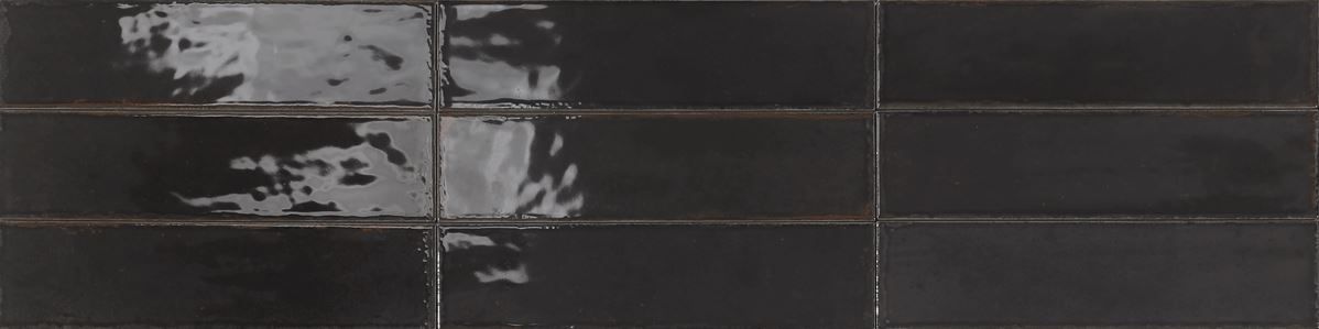 Dark tiled wall with a vertical crack and worn, peeling patches on the left side