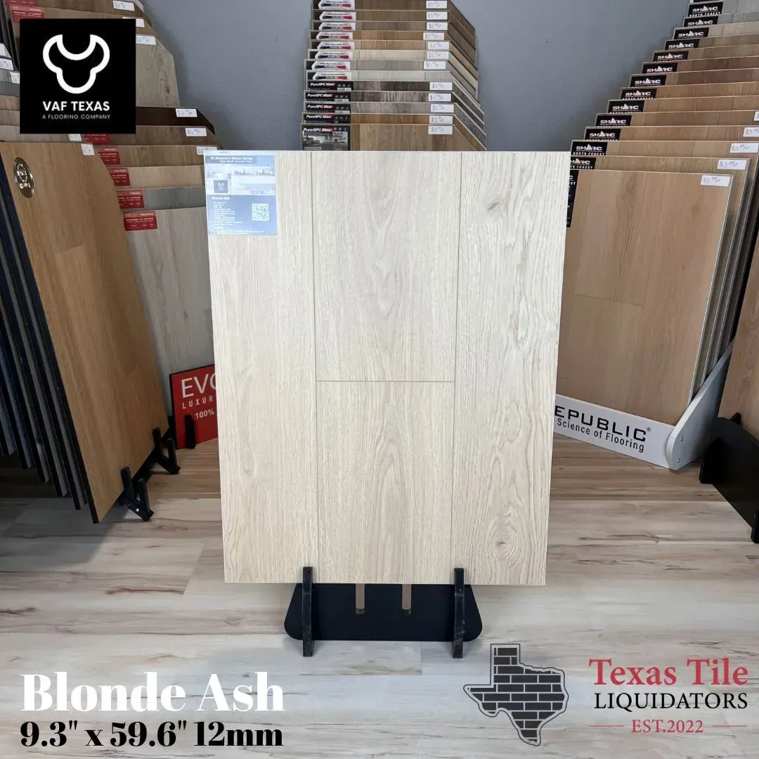Display of Blonde Ash flooring planks in a showroom, featuring a light wood grain finish and 9.3