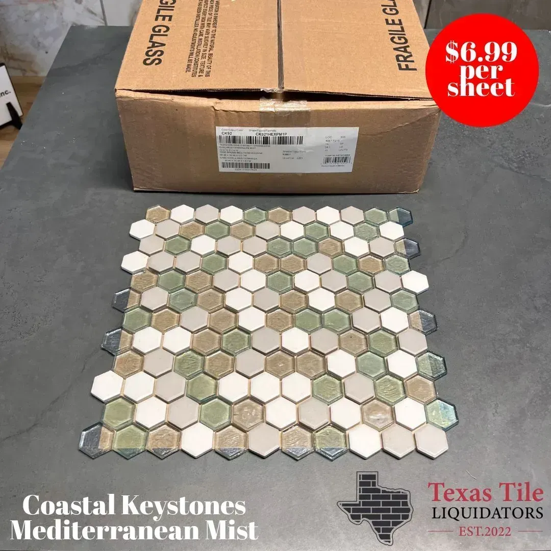 A sheet of Coastal Keystones Mediterranean Mist hexagonal glass tiles in green, white, and tan, priced at $6.99 per sheet.