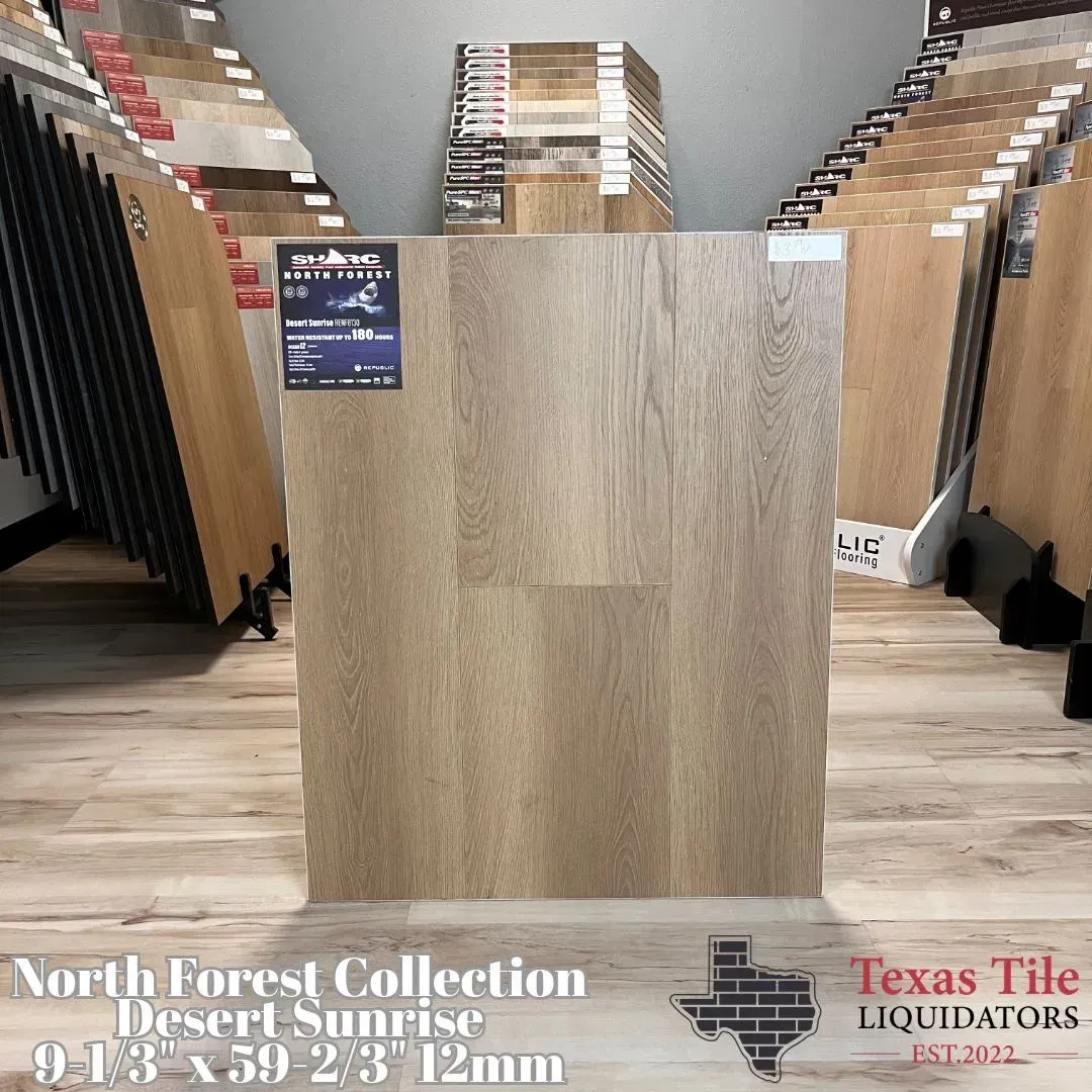 Wood-look floor sample display at a Texas Tile gallery, with stacked tile samples in the background.