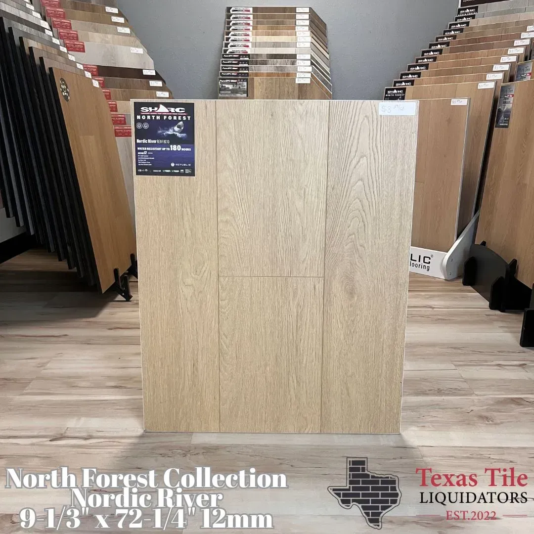 Wood flooring display with a large light oak sample in a showroom, flanked by rows of samples
