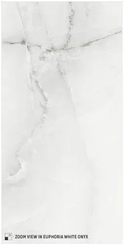 A close-up view of white marble tile featuring subtle, flowing light gray veining.