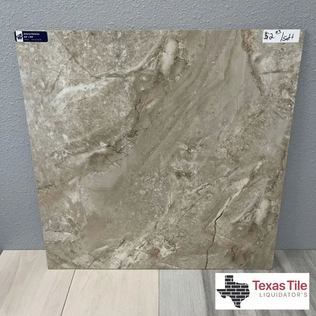 A square, beige and brown marble-look tile on display with a Texas Tile Liquidators logo in the corner.