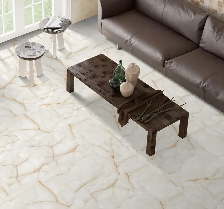 A modern living room with a brown leather sofa, a dark wooden coffee table, and white marble-patterned flooring.