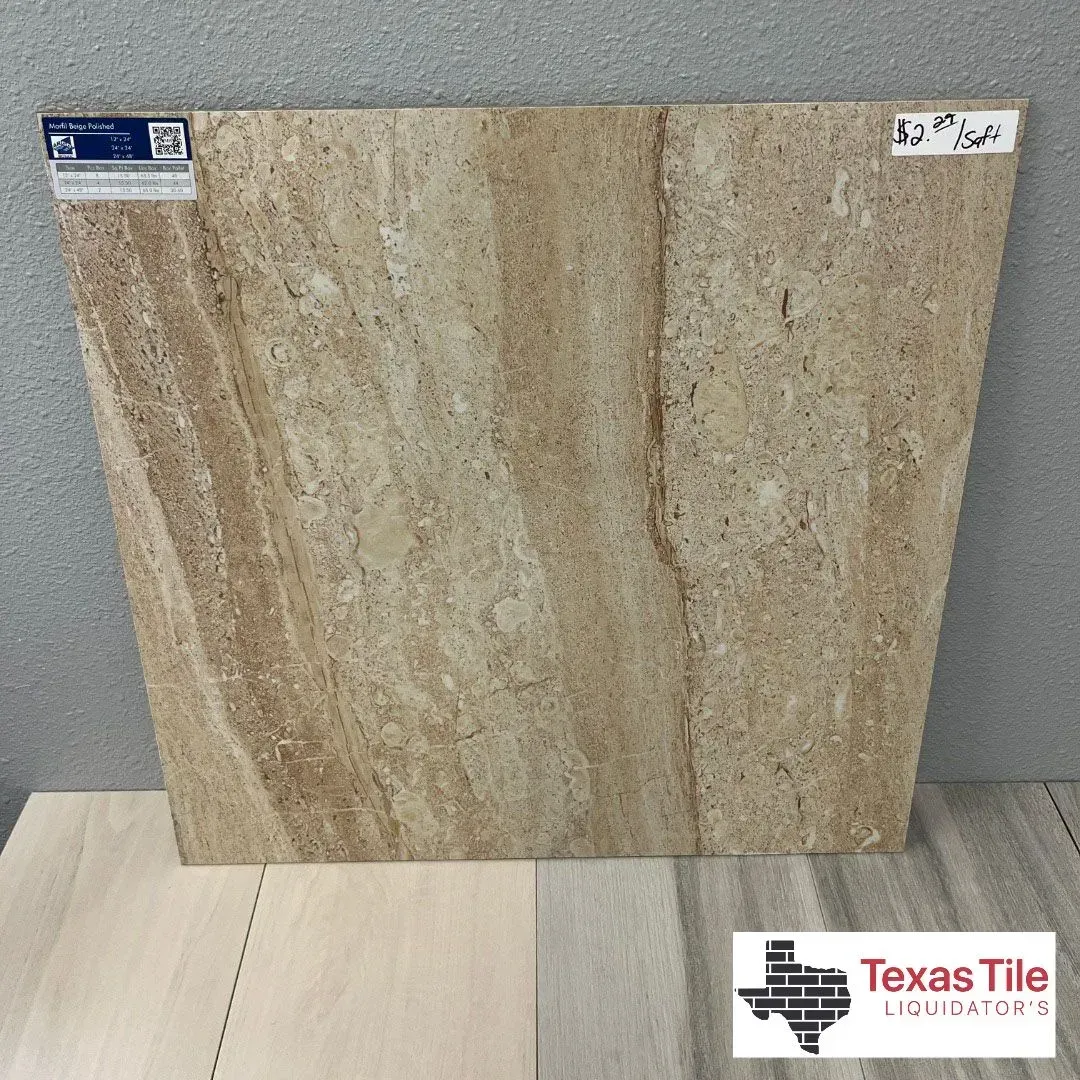 A tan and beige travertine-look ceramic tile sample displayed against a wall with a Texas Tile Liquidators logo.