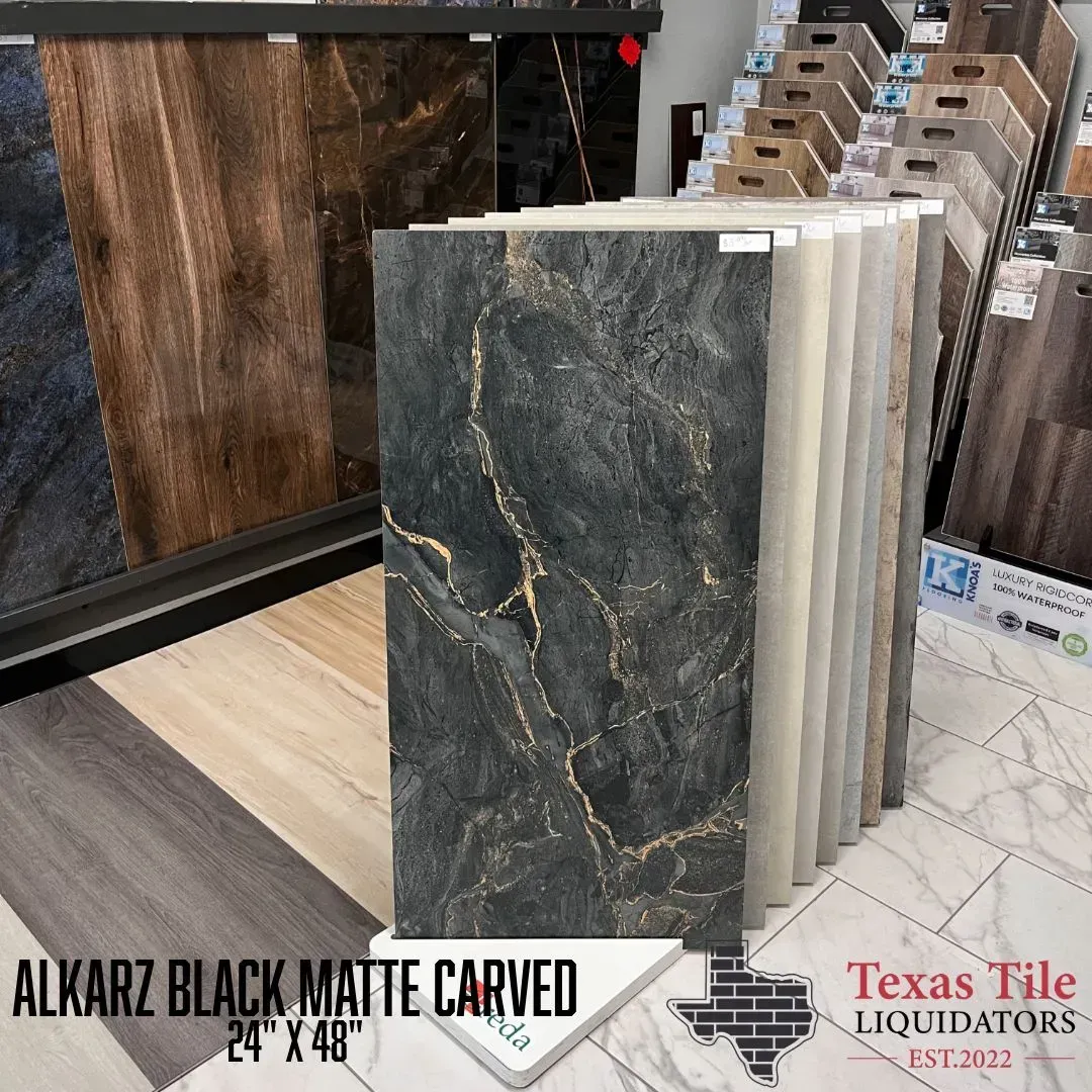 A display rack showing Alkarz Black Matte Carved 24