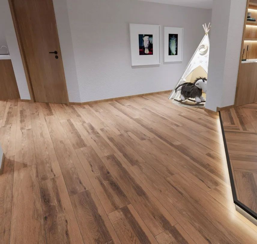 A modern interior features light wood floors, two framed wall pictures, and a child’s play teepee in a recessed nook.