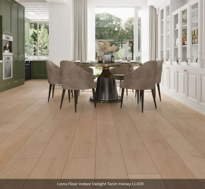 Dining room with a light oak floor, a round table, four grey chairs, green cabinetry, and white built-in storage.
