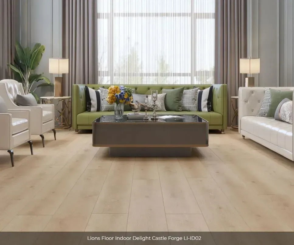 A modern living room with light wood flooring, a green tufted sofa, two white armchairs, and a central coffee table.