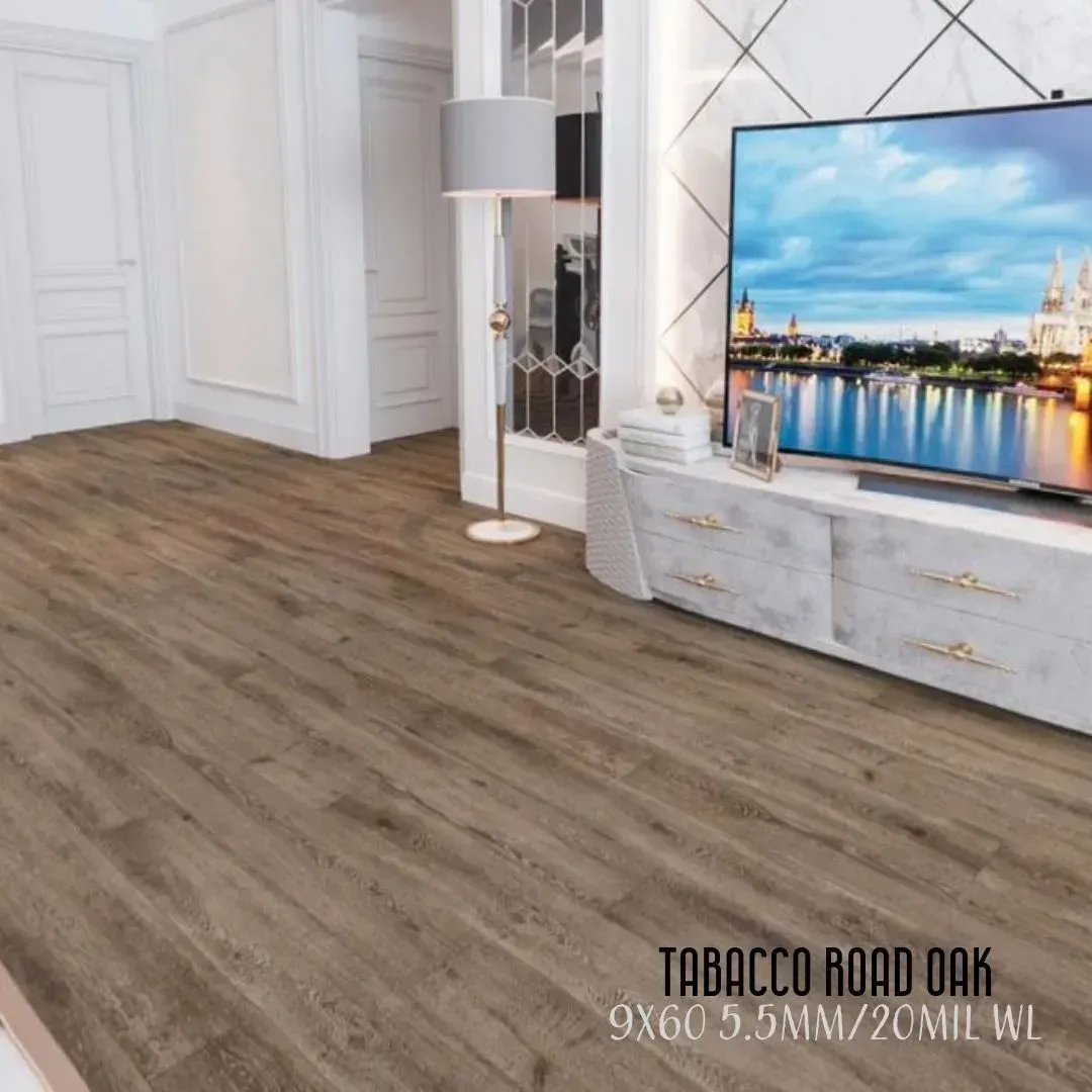 Modern living room with wood flooring, white walls, TV, and glass cabinet.