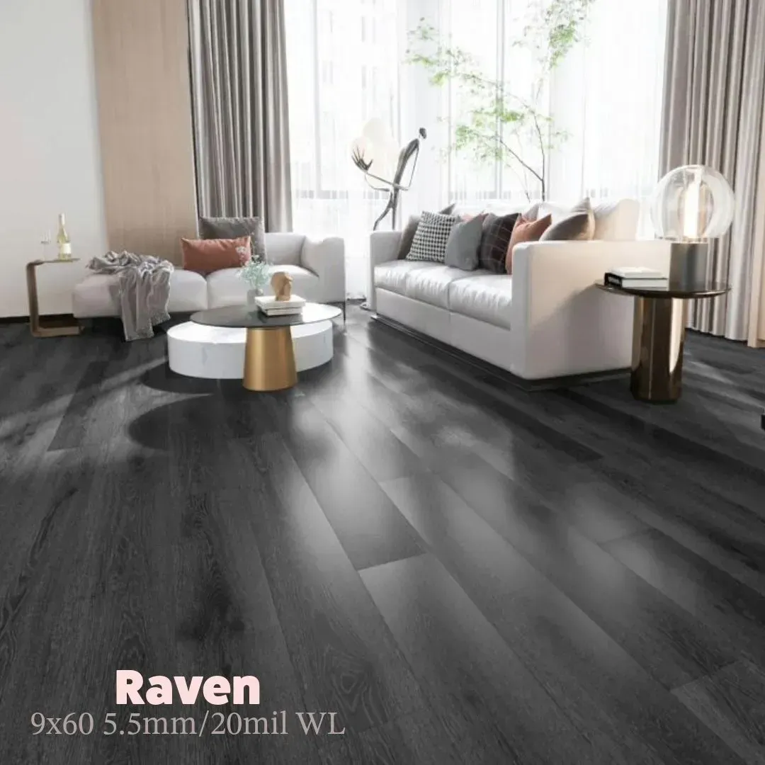 A modern living room with dark charcoal wood plank flooring, light-colored sofas, and large floor-to-ceiling windows.